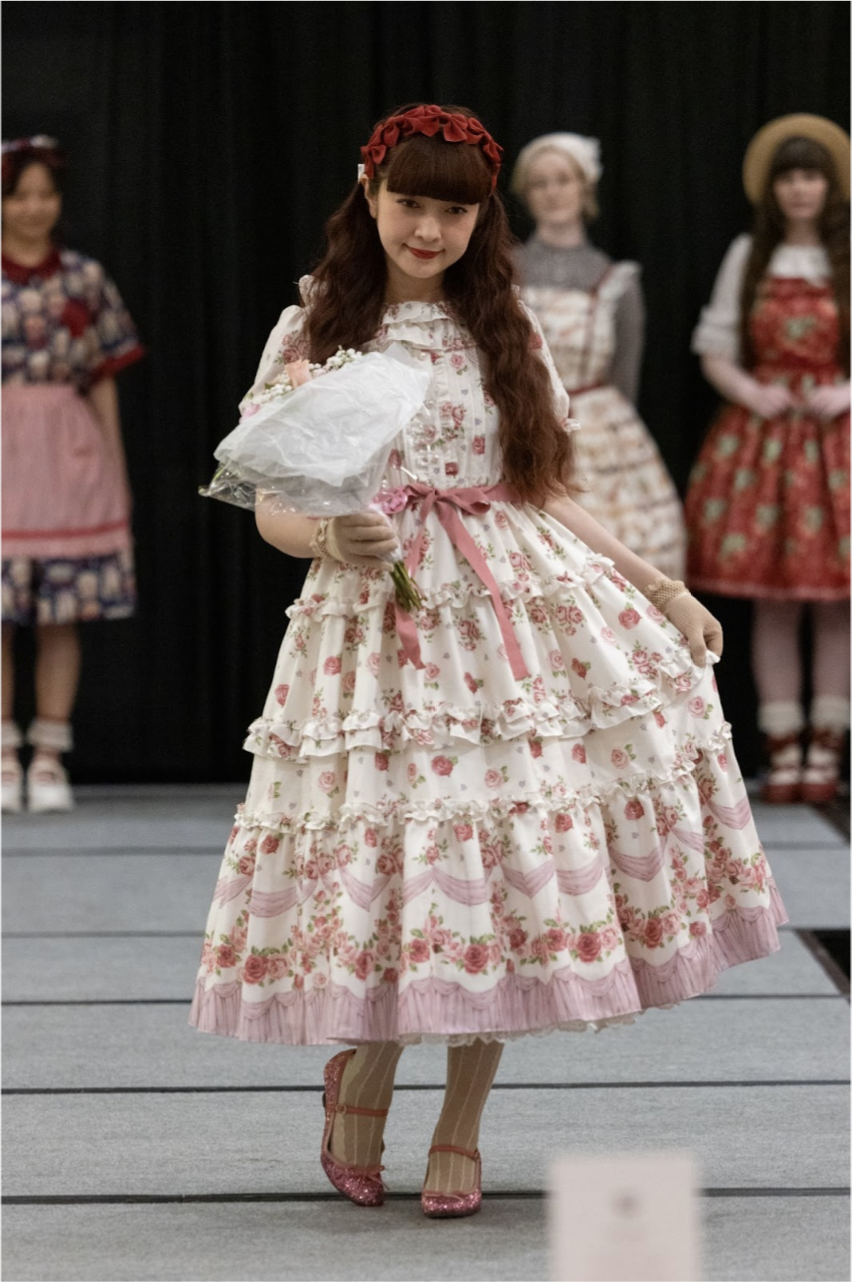 A model showing walking the runway in a lovely dress.