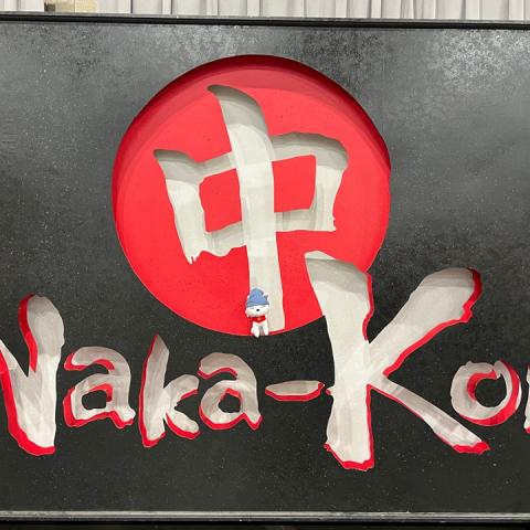 Inari hanging out in the Naka logo