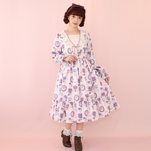 This dress is a floral print dress, featuring a pattern of purple flowers.