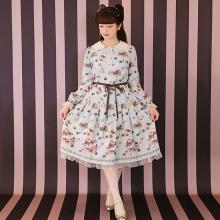 This dress is a light blue dress with a white collar and a bow featuring a floral pattern.