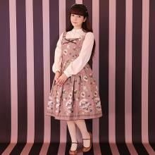 This dress is a pink dress with a white chemise featuring a pattern of boxes of chocolates.